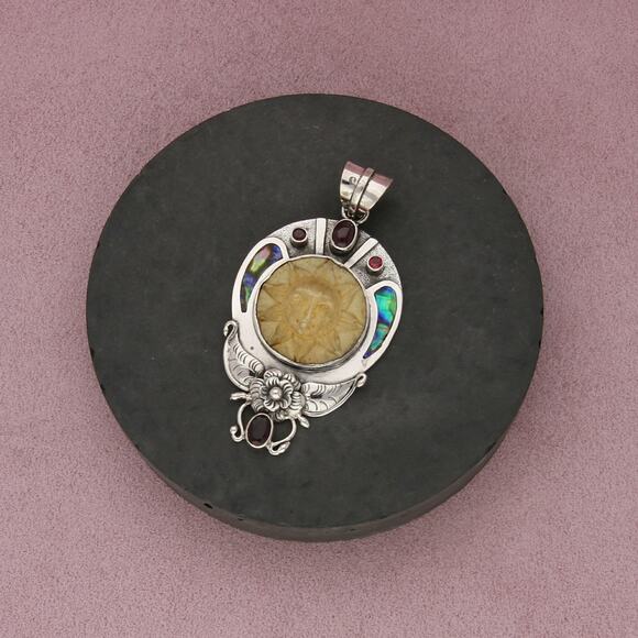 Sterling Jewelry - sterling silver abalone garnet carved sun pendant